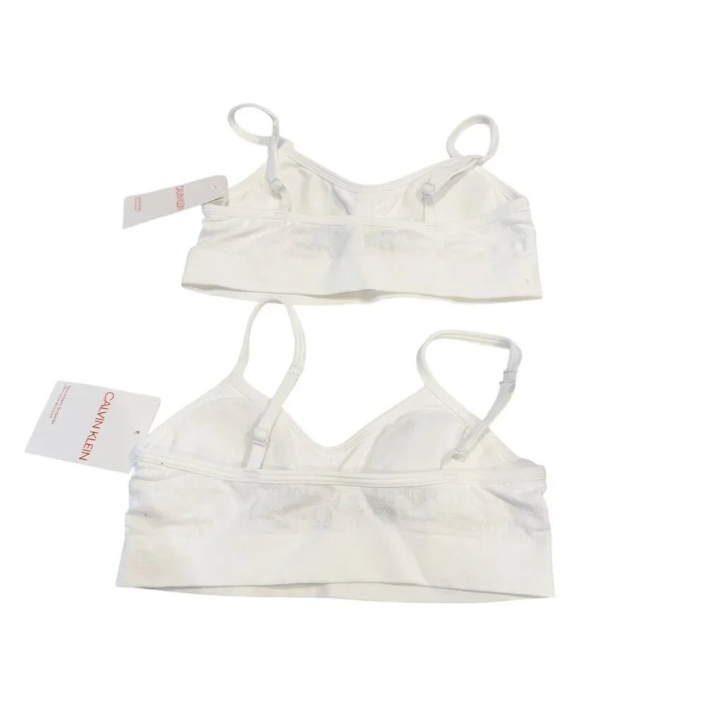 Two Calvin Klein Girl's Seamless Signature Bralettes White Size S (6/6X) NWT
